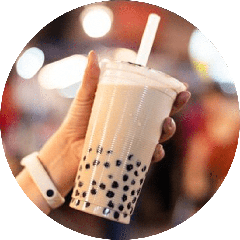 Hand holding a bubble tea drink.