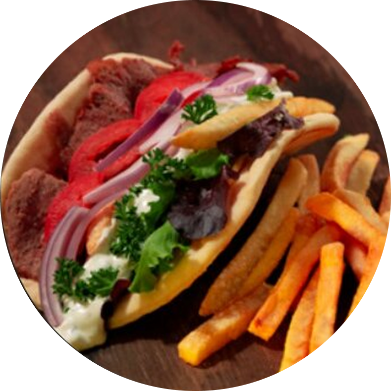 Gyro with fries on a wooden plate.