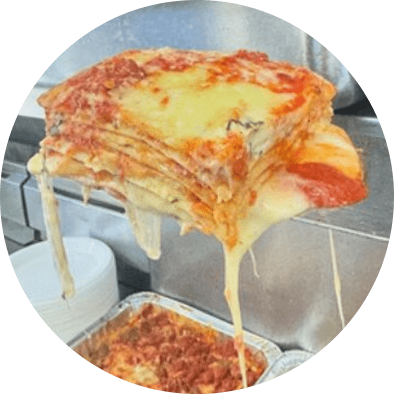 Cheesy lasagna slice with melting layers.