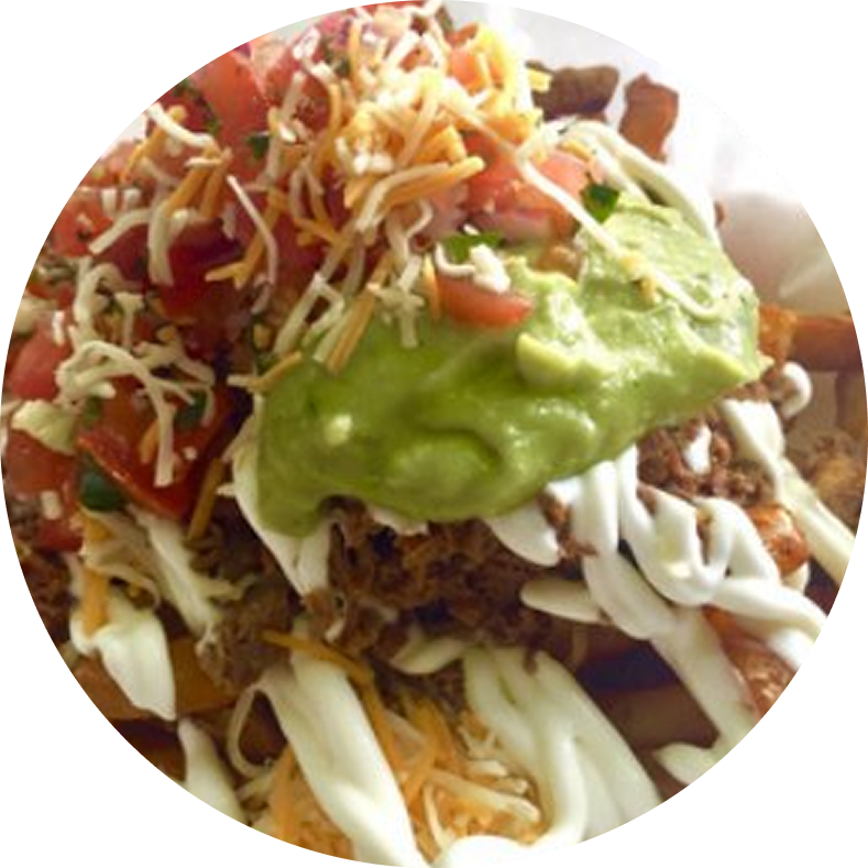 Loaded fries with guacamole and toppings.